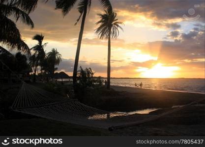 Sunset and hammock on the beach near Nadi in Fiji
