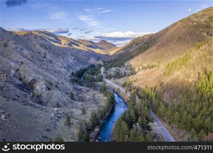 sunset and moon rise over mountain river canyon - Poudre River in northern COlorado aerial view in early spring