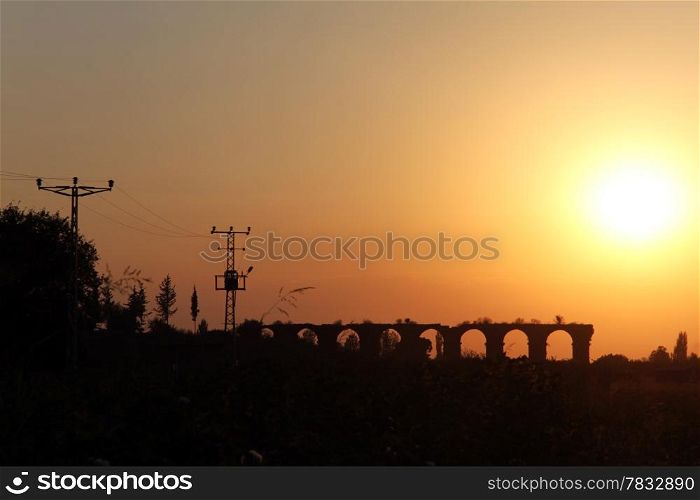 Sunset and ruins of aquaduct in Aspendos, Turkey