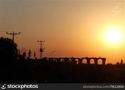 Sunset and ruins of aquaduct in Aspendos, Turkey