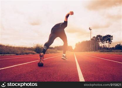 Sunset and Young man running on lane. Success and goal of business concept. Sport athletic and exercise theme.