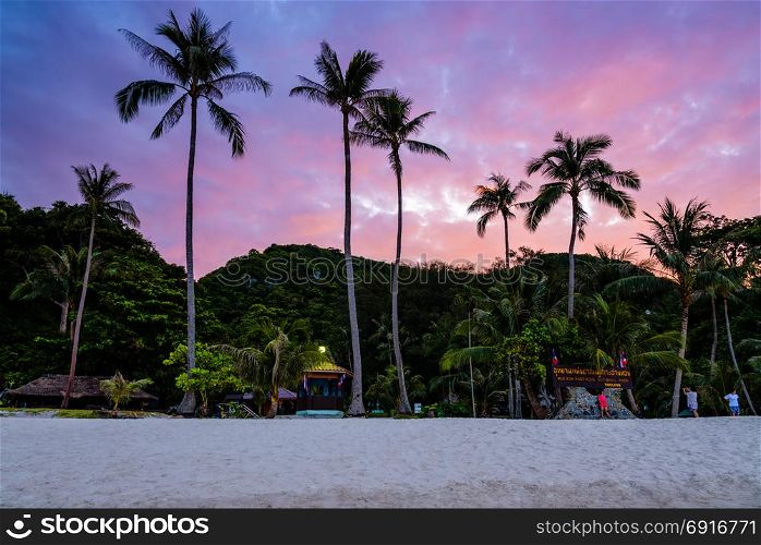 Sunset at Ko Wua Ta Lap island. Beautiful natural landscape of coconut trees on the beach in front of Ko Wua Ta Lap island, under the colorful sky at sunset, Mu Ko Ang Thong National Marine Park in Gulf of Thailand, Surat Thani province