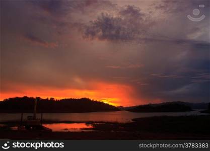 Sunset at lake, Kaeng Krachan Dam on Silhouette