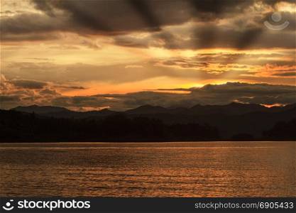 Sunset at lake, Kaengkrachan National Park Thailand, Abstract nature background in the twilight with sunset
