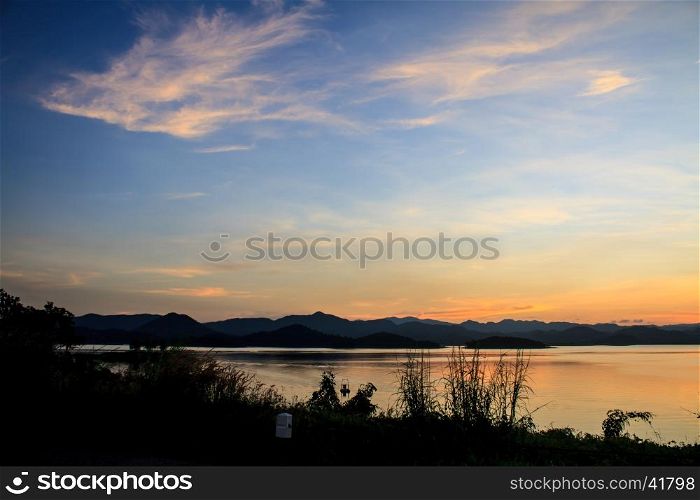 Sunset at lake, Kaengkrachan National Park Thailand,Sunset over lake with the beautiful cloud