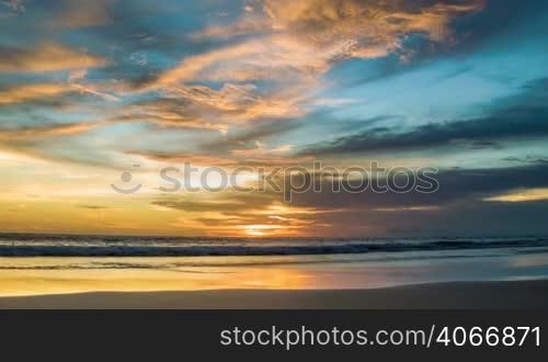 Sunset at ocean with blue and yellow colors