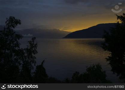 sunset at the sognefjord in norway near the place called Vik