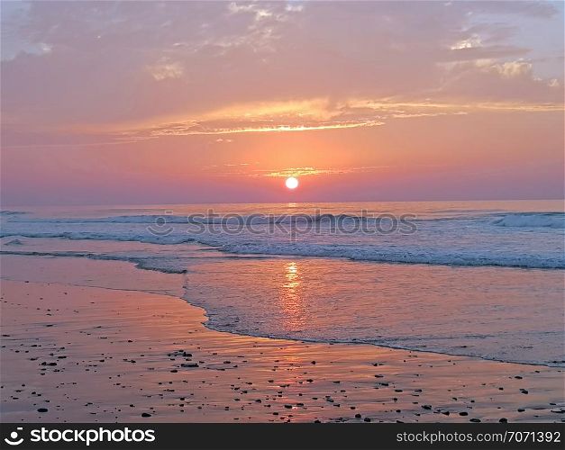 Sunset at Vale Figueiras beach in Portugal