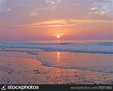 Sunset at Vale Figueiras beach in Portugal