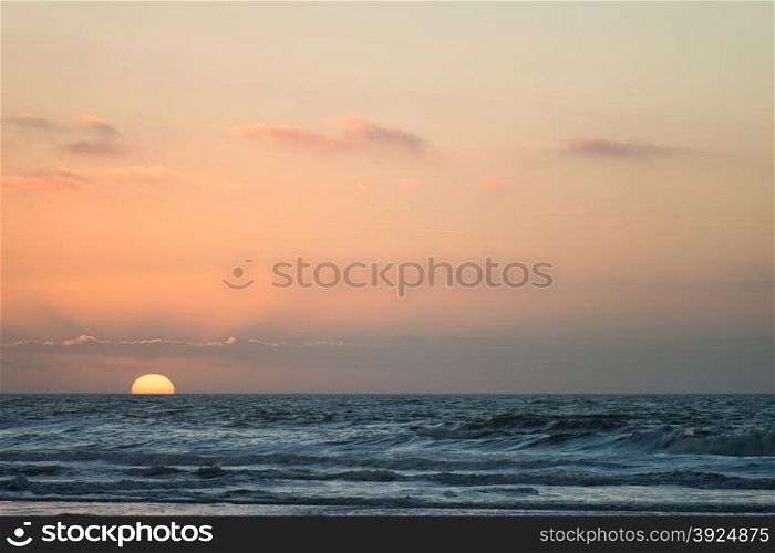 Sunset beach ocean. Sunset beach and ocean with sand dunes and clouds