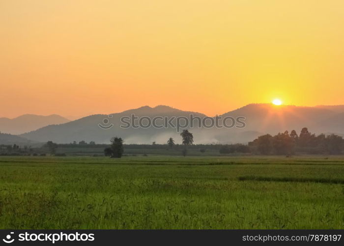 sunset behind mountains