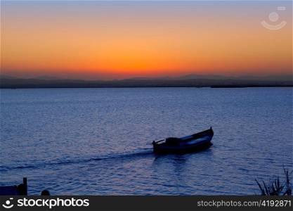 sunset boat in Albufera lake Valencia Mediterranean Spain