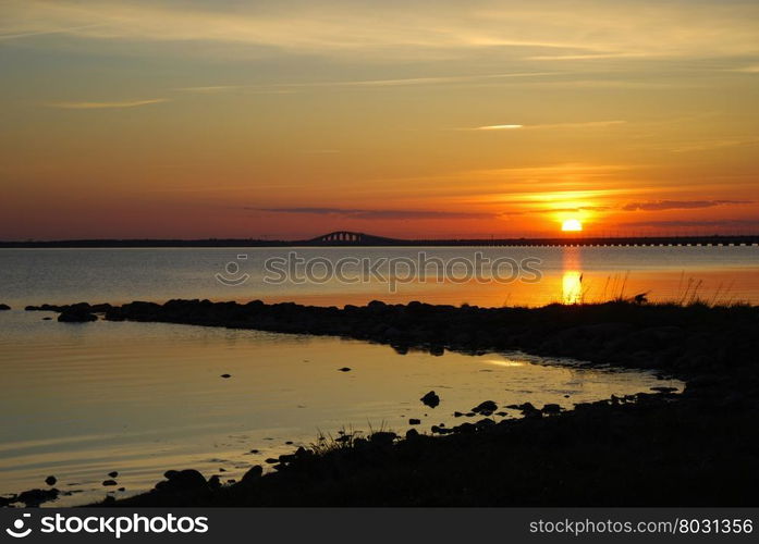 Sunset by the Oland bridge. View from the Swedish island Oland.