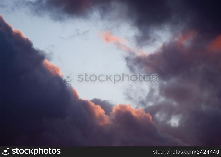 Sunset clouds in intense shades of red, orange and black