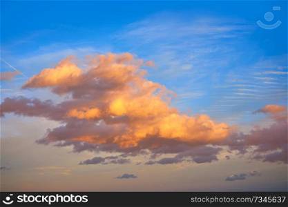 Sunset clouds in orange and blue sky background