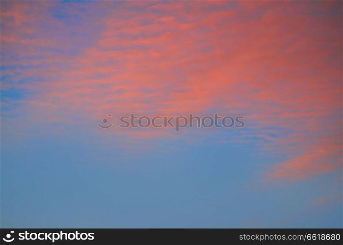 Sunset clouds sky in orange and blue background