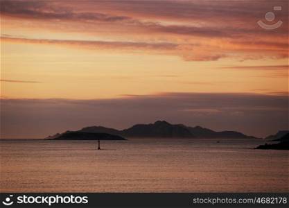 sunset from the beach of Baiona, Galicia, Spain. View of the Cies islands