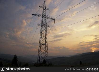 Sunset in Carpatian mountains in summer and electrified track