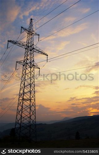 Sunset in Carpatian mountains in summer and electrified track