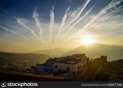 Sunset in Chefchaouen, the blue city in the Morocco.. Chefchaouen, the blue city in the Morocco is a popular travel destination
