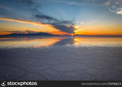 Sunset in Salar de Uyuni salt flats desert, Andes Altiplano, Bolivia. Salar de Uyuni desert, Bolivia