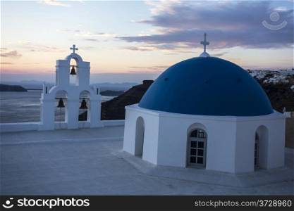 Sunset in Santorini church (Firostefani), Greece