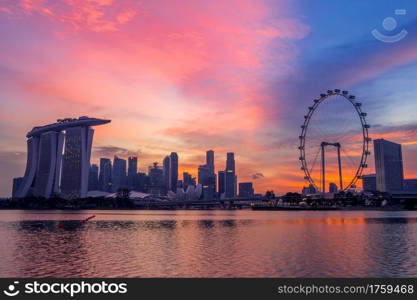 Sunset in Singapore. Skyscrapers and main showplaces Singapore Flyer, Marina Bay Sands, Art Science Museum. Singapore at the Pink Sunset