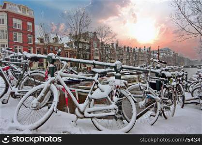 Sunset in snowy Amsterdam in the Netherlands in winter