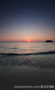 Sunset in Thailand. Beautiful sunset over sea and boat in Thailand