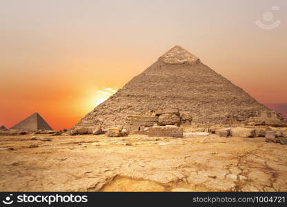 Sunset in the desert and the Pyramid of Khafre, Egypt.. Sunset in the desert and the Pyramid of Khafre, Egypt