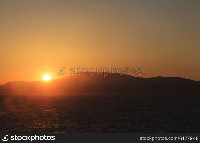 Sunset in the open sea with lense flares&#xA;