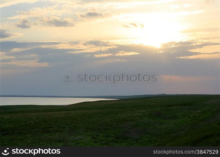 Sunset in the steppe near the salt lake Lopuhovatoe, Rostov region, Russia.