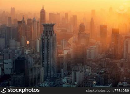 Sunset light over the skyline of urban architectural landscape in the Bund, Shanghai, China. The skyline of urban architectural landscape in the Bund at sunset, Shanghai, China
