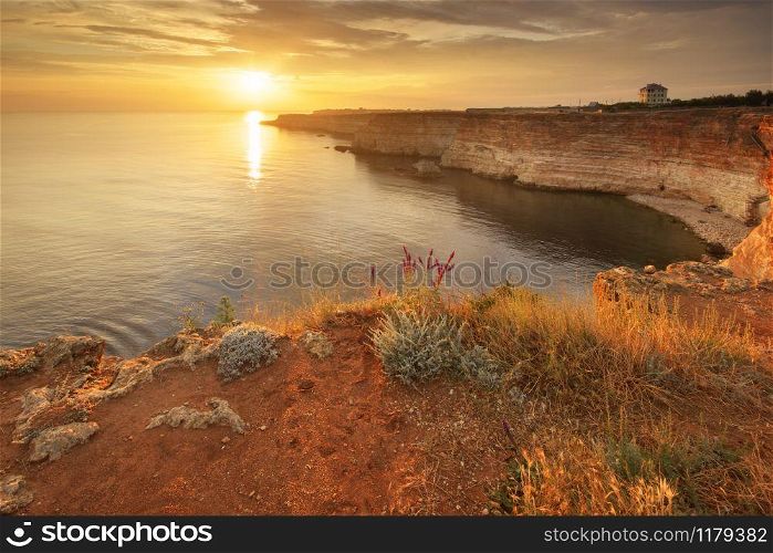 Sunset on cliffs. Beautiful summer nature and sea landscape. Relax composition.
