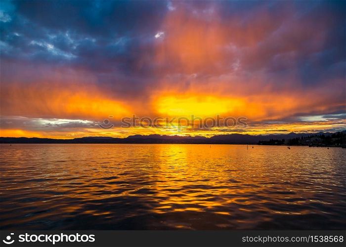 Sunset on Garda lake in Italy in a beautiful summer evening