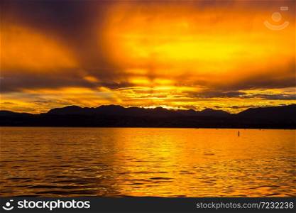 Sunset on Garda lake in Italy in a beautiful summer evening