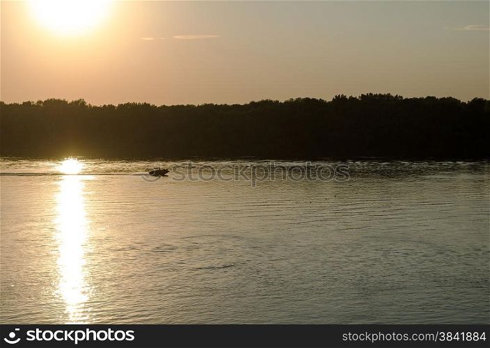 sunset on the Danube river and boat