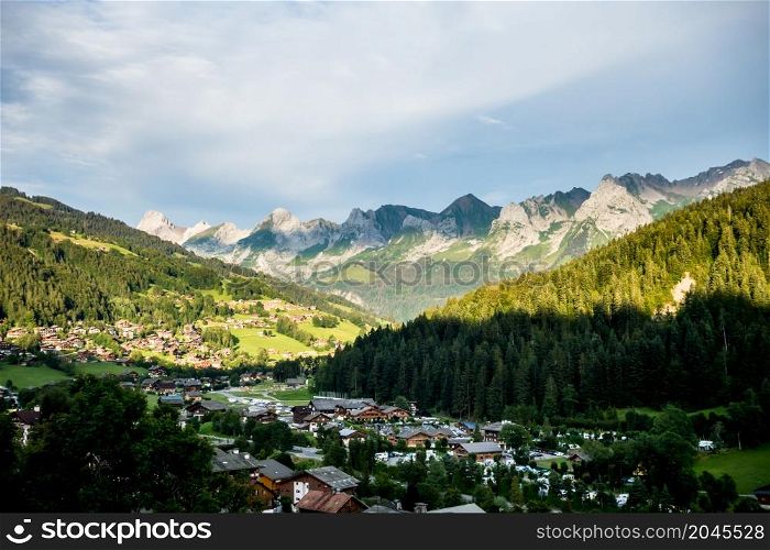 Sunset on The Grand-Bornand village and the Aravis mountain range, France. Sunset on The Grand-Bornand village and the Aravis mountain range