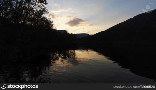 sunset on the mountain lake