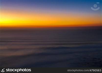 sunset on the ocean in portugal ilustrating the dimension of the ocean