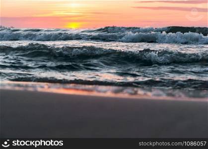 sunset on the sea, sea waves red from sunlight. sea waves red from sunlight, sunset on the sea