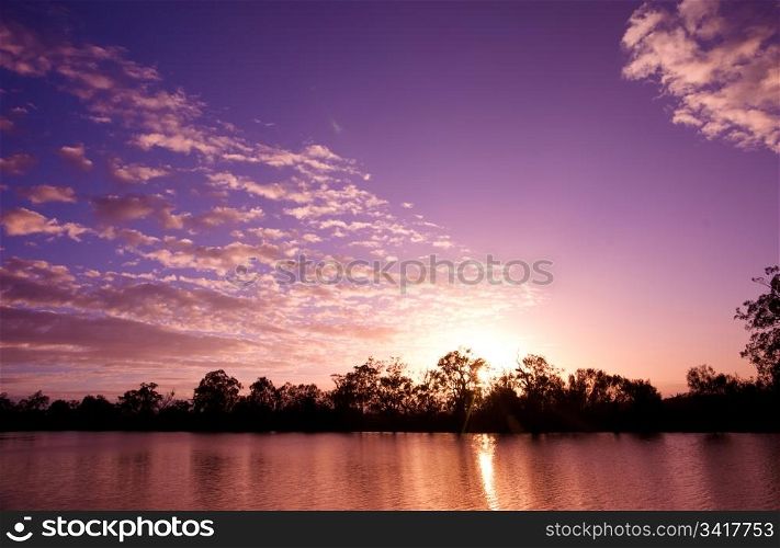sunset on the water of the river murray south australia