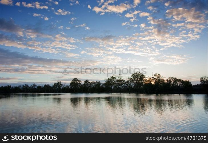 sunset on the water of the river murray south australia
