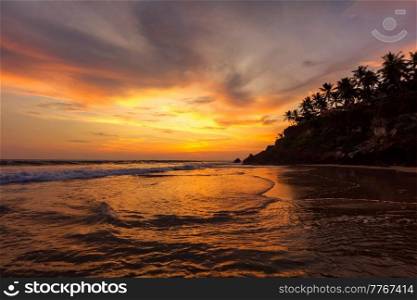 Sunset on Varkala beach popular tourist destination in Kerala state, South India. Sunset on Varkala beach, Kerala, India