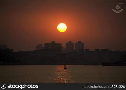 Sunset over a city, Shamian Island, Guangzhou, Guangdong Province, China