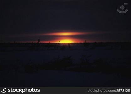 Sunset over a frozen landscape, Churchill, Manitoba, Canada