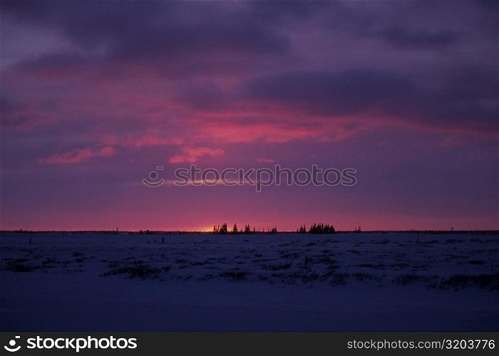 Sunset over a frozen landscape, Churchill, Manitoba, Canada