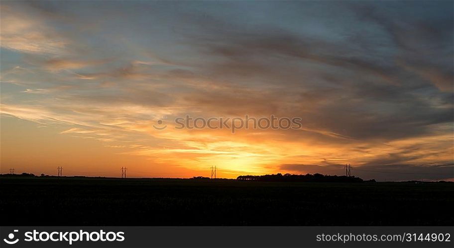 Sunset over a prairie field, Manitoba, Canada