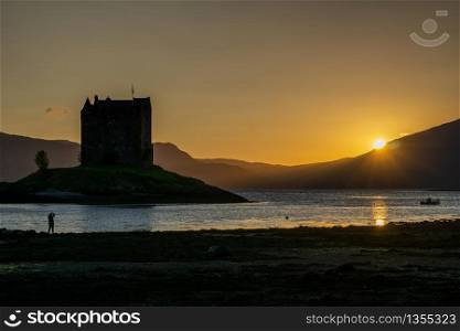 Sunset over Castle Stalker is a four storey tower house or keep picturesquely set on a tidal islet on Loch Laich, an inlet off Loch Linnhe. It is about 1.5 miles north-east of Port Appin, Argyll, Scotland,