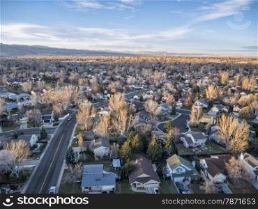 sunset over Colorado Front Range town - aerial view of Fort Collins on a typical swnowless fall or winter day from a low flying drone